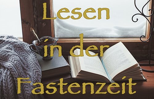 Warm and comfy winter concept. Book, cup of lemon tea and sweater on wooden window sill in old house. Reading and relaxing in cold snowy weather at home. Quiet silent homely scene.