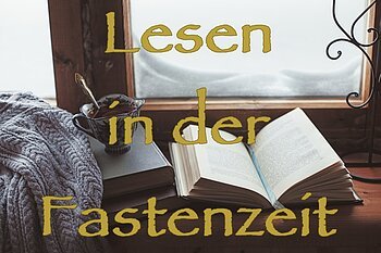 Warm and comfy winter concept. Book, cup of lemon tea and sweater on wooden window sill in old house. Reading and relaxing in cold snowy weather at home. Quiet silent homely scene.